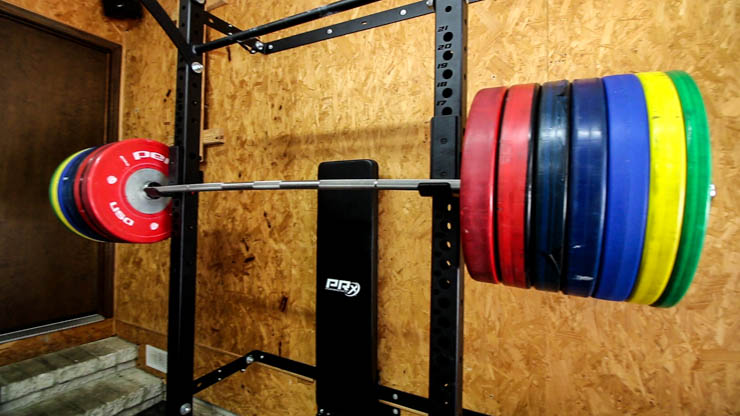 PRx Performance Profile Squat Rack with barbell and bumper plates