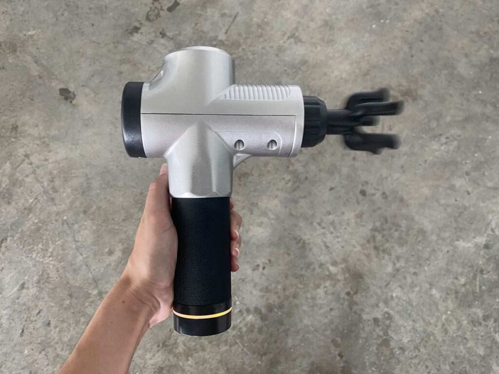 Chirogun massage gun in use