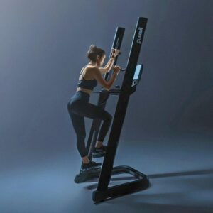 a woman using the CLMBR vertical climbing machine