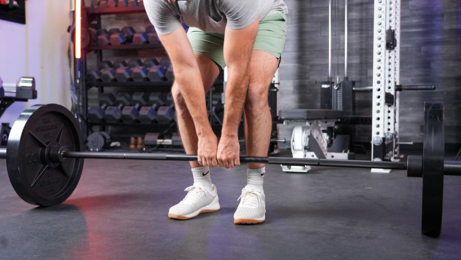 Man performing a close grip deadlift on the Hades bar