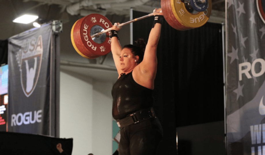 Coach Mary lifting weights on the Rogue state at the Arnold Fitness Festival