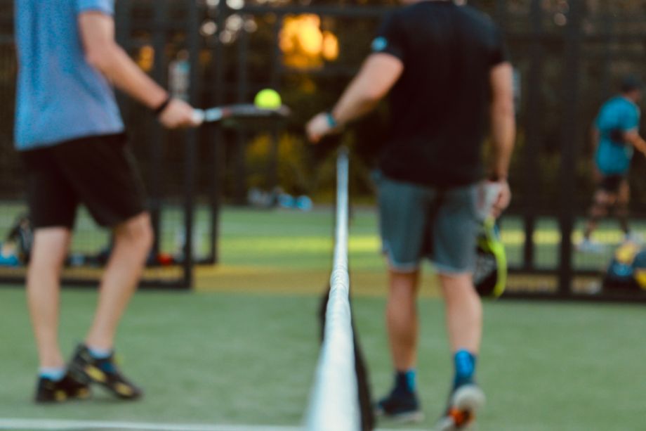 Coach with tennis athlete