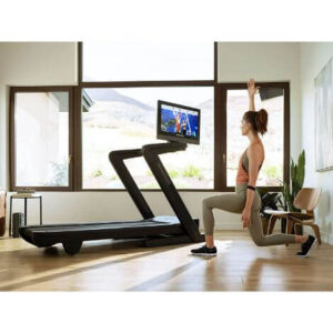 commerical 2450 treadmill woman lunging next to