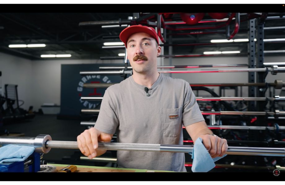 Man holding barbell with rag