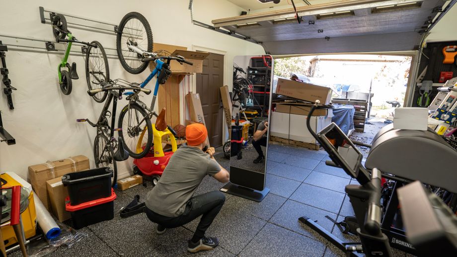 Coop doing squats in front of the ProForm Vue