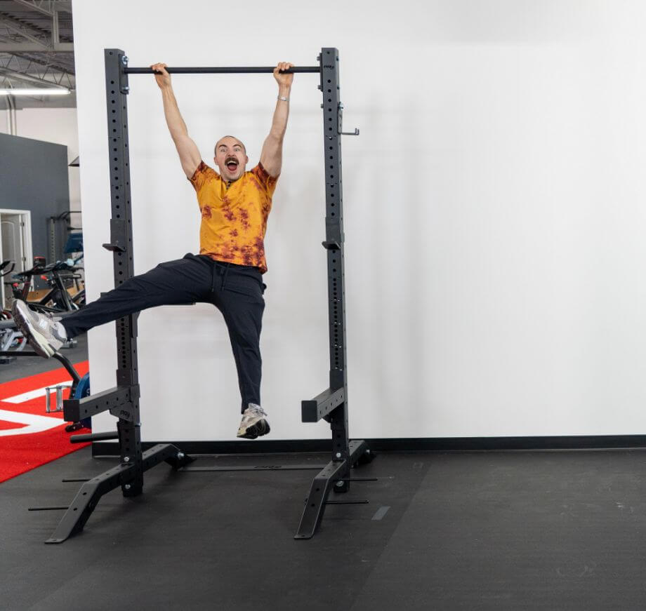 coop hanging on pull-up bar PRx Build Limitless Rack