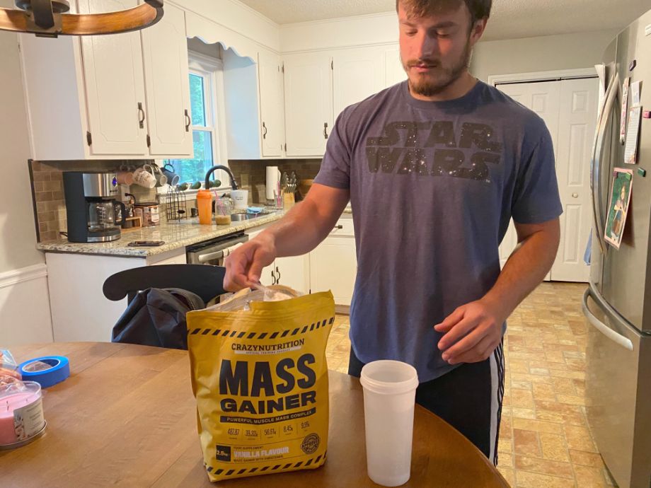Crazy Nutrition Mass Gainer Man In Kitchen