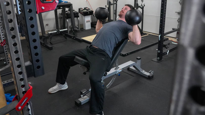 Man doing presses on the REP Fitness AB-5000