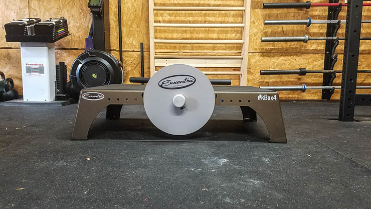 Exxentric kBox4 Flywheel Training in a garage gym