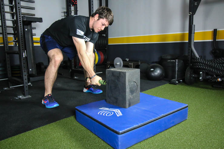 man using the BAMF Hammer on a pad