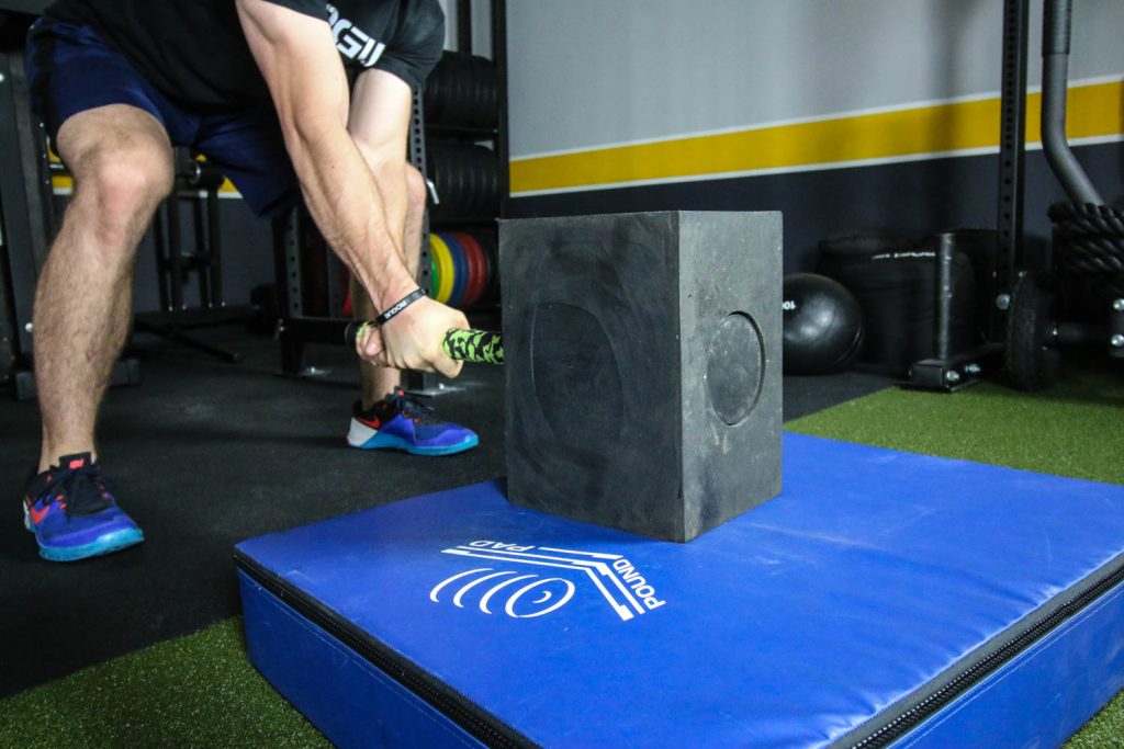 man using the BAMF Hammer on a pound pad