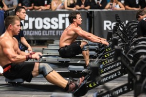 men using a rowing machine