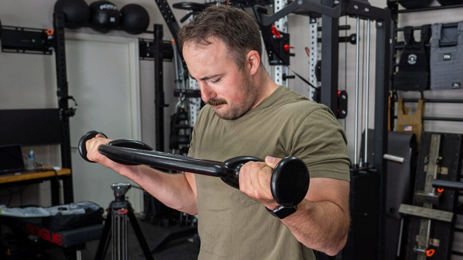 coop using the Mutt Bars Weighted Exercise Bar