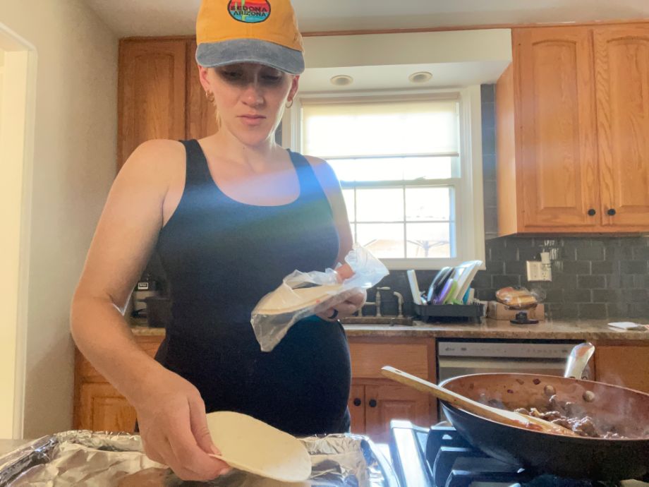 Woman making turkey taquitos from Dinnerly