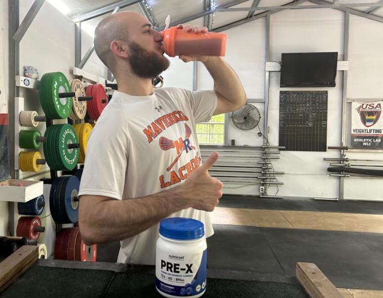 Man drinking Nutricost Pre-X Pre-Workout