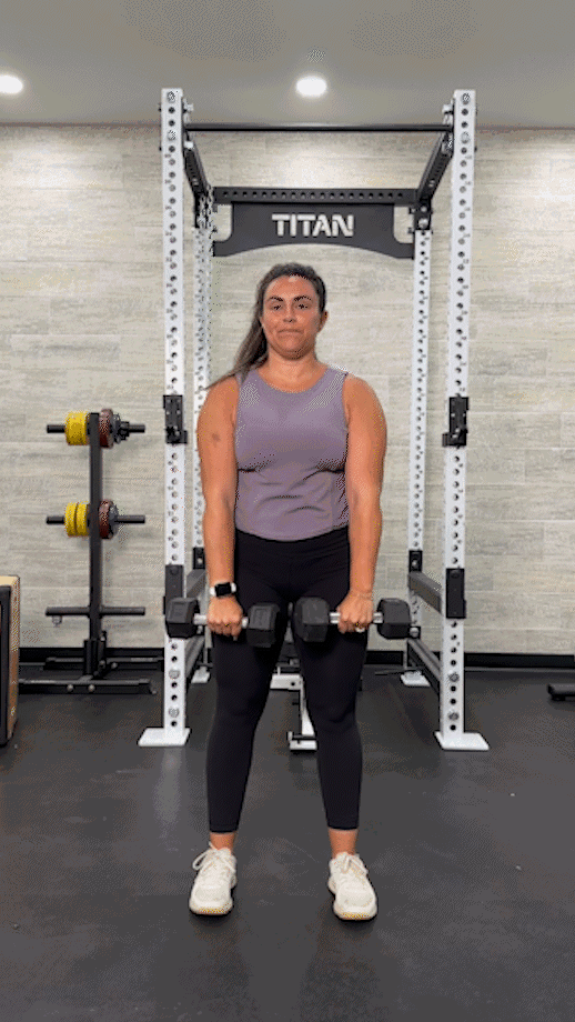 woman doing a dumbbell upright row
