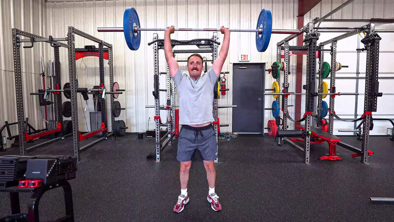 coop with an olympic barbell