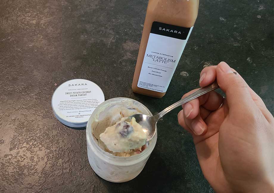 Eating a Sakara parfait and latte