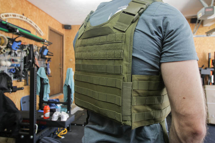 man wearing the army green Invest Pro Weight Vest