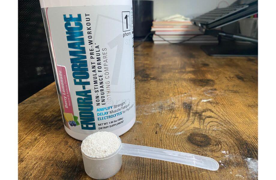 A scoop of 1st Phorm Endura-Formance,
a stim-free pre-workout, next to the supplement container