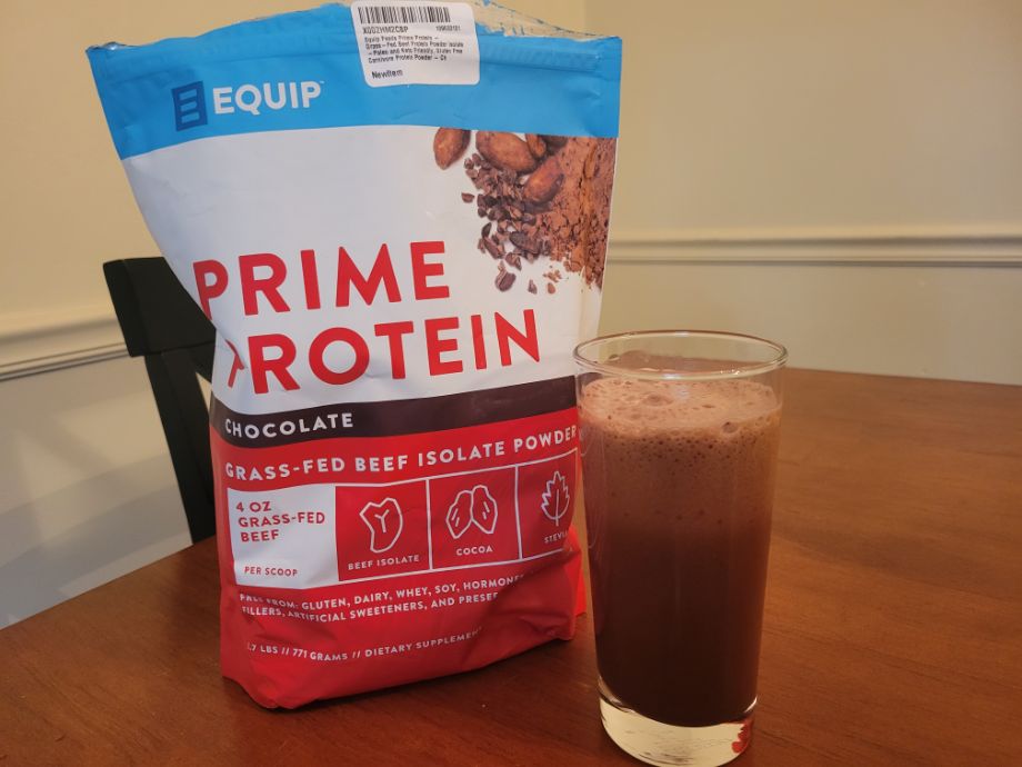 A glass of Equip Foods Prime Protein