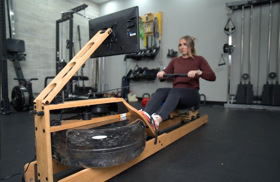 Woman rowing on Ergatta Lite