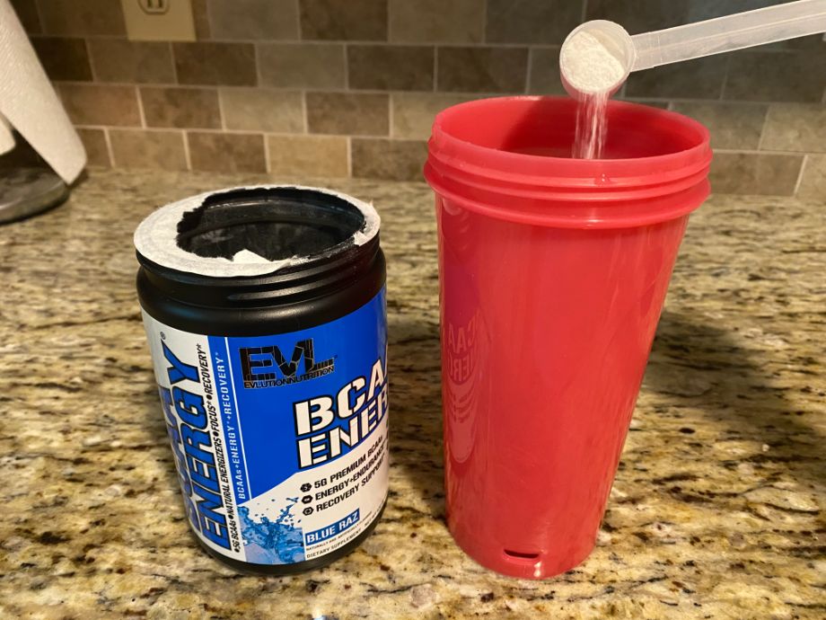 Evlnutrition BCAAs going into a cup