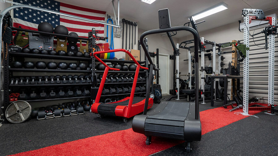 TrueForm Trainer and TrueForm Runner in garage gym 