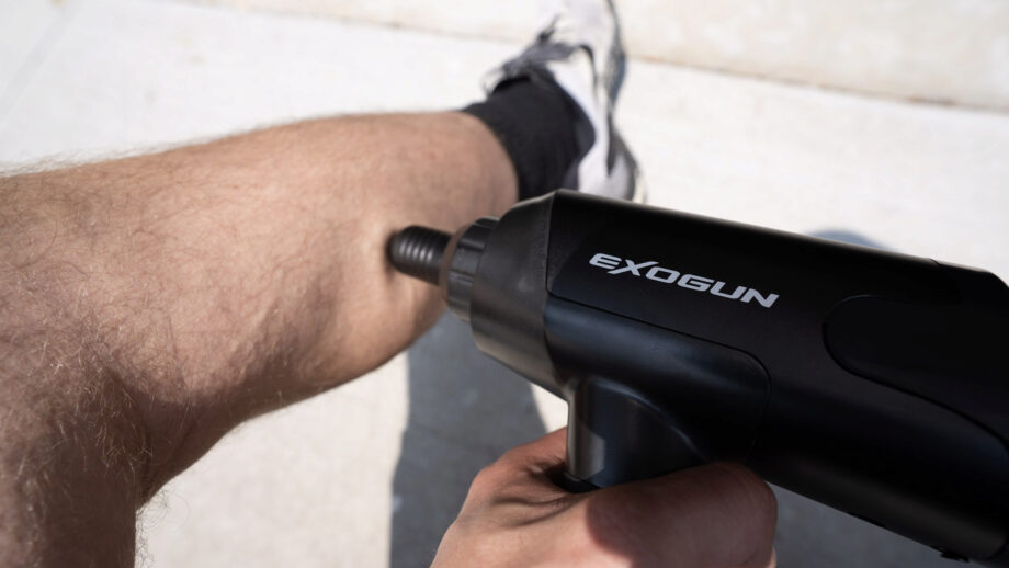 Exogun Massage Gun on calves