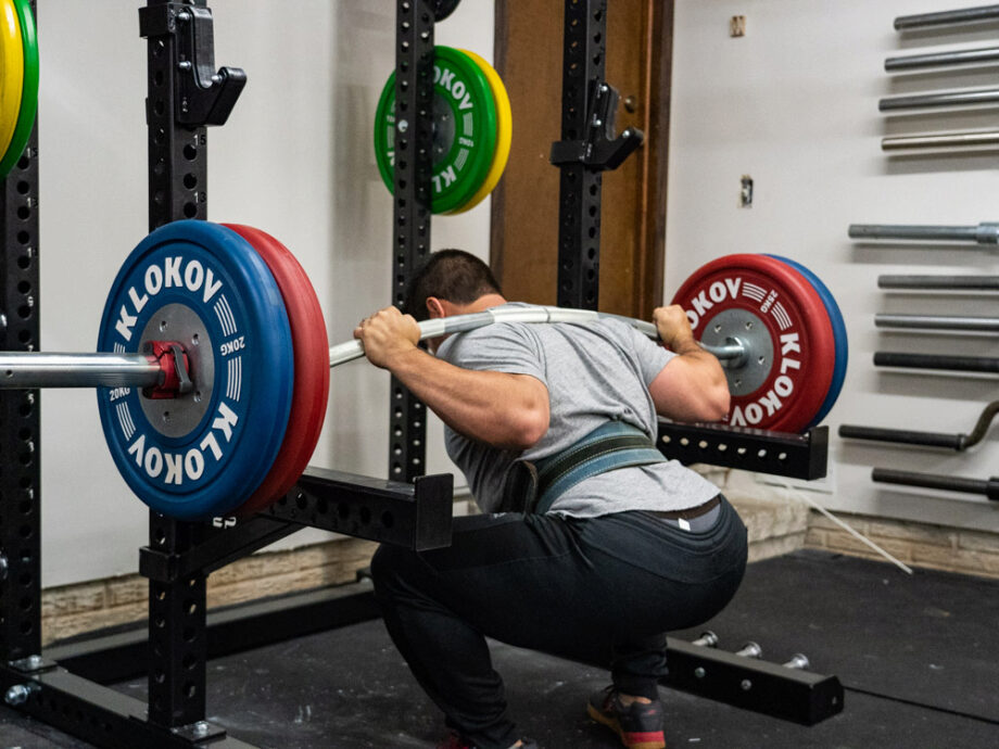 man using Fringe Sport Longhorn Buffalo Bar in garage gym