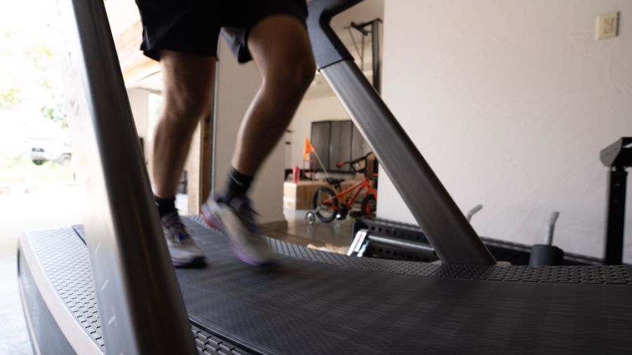 An image of feet running on a treadmill