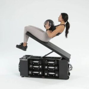 A woman using the Fitbench 1.