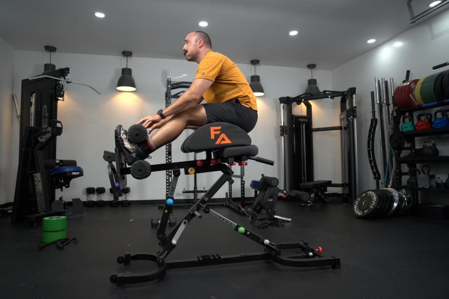 Man using the Freak Athlete Hyper Pro for GHD sit-ups