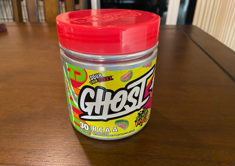 A container of Ghost BCAAs on a table