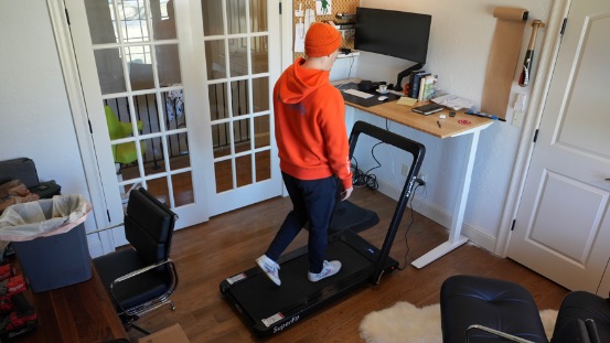 Coop using the goplus treadmill.