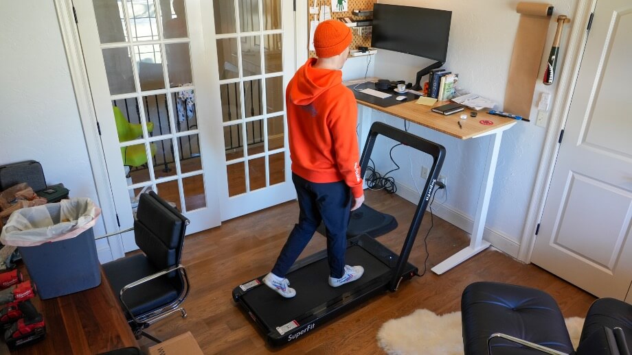 Coop walking on the Goplus treadmill.