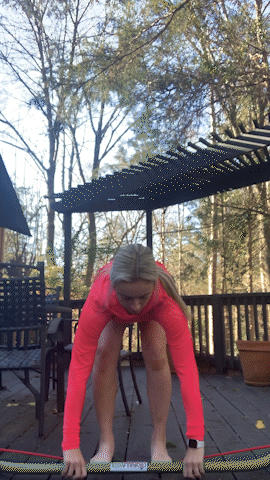 Caroline using the Gorilla Bow to do an upright row.
