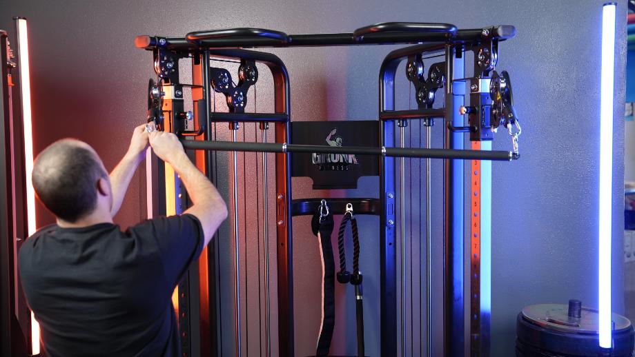 Coop hooks up the straight bar attachment on the Gronk Fitness Functional Trainer.