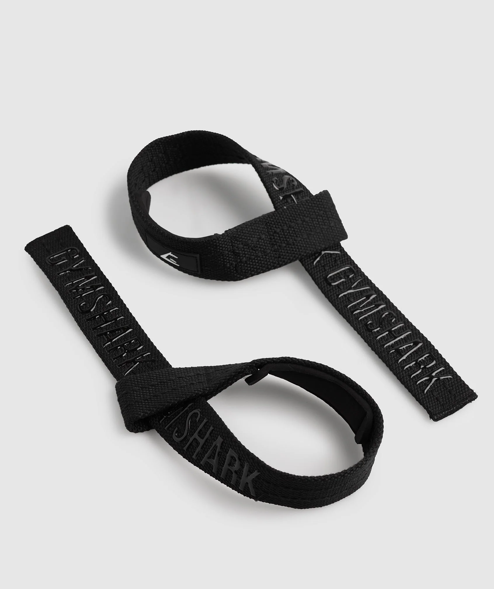 https://www.garagegymreviews.com/wp-content/uploads/gymshark-silicone-grip-lifting-straps.webp