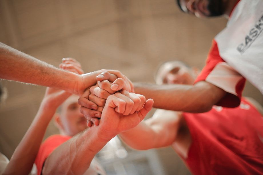 hands joining together after group exercise