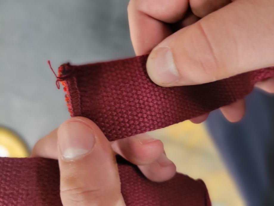 A frayed loose thread on the Harbinger Straps