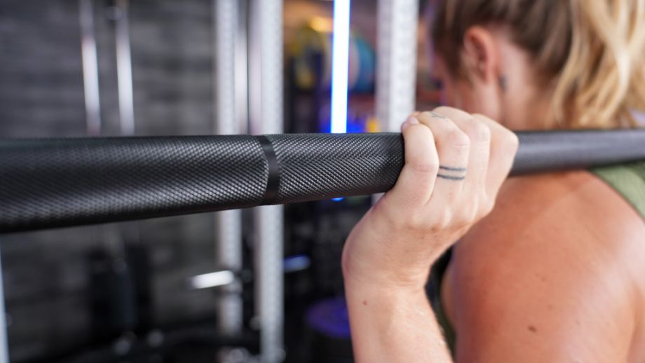 Close up of the mountain knurl of the Helios squat bar while in use