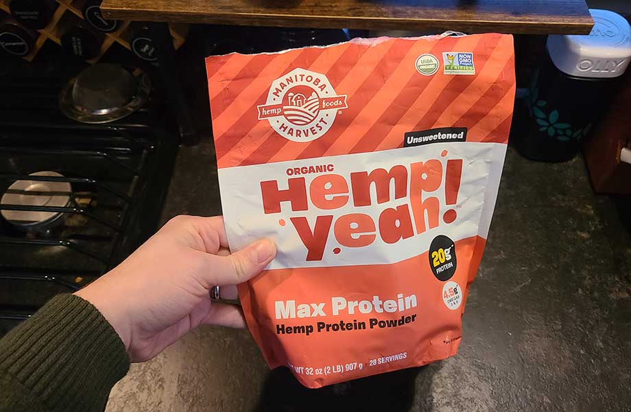 Person holding a bag of Hemp Yeah! protein powder