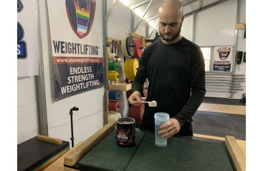 A person mixes up a batch of Huge Supplements Pump Serum.