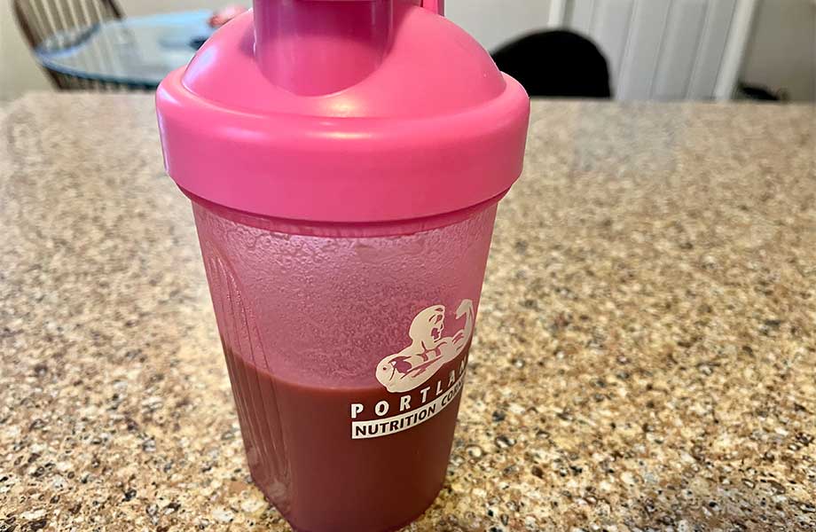 A shaker cup of Innermost The Health Protein, freshly mixed.