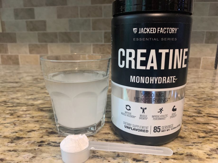 Jacked Factory Creatine Monohydrate with a scoop and a glass