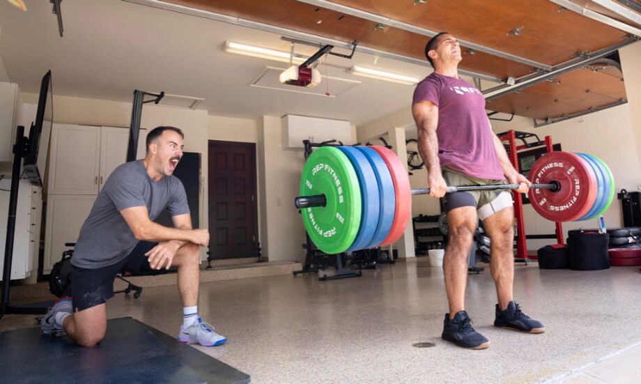 Coop and Jason Khalipa in a home gym deadlifting