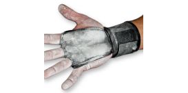 jerkfit wodies gymnastics grips on a man's hand with gym chalk