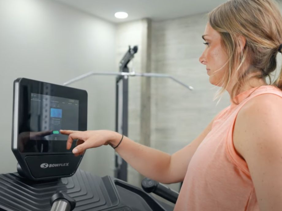woman using JRNY app on Bowflex Treadmill 10