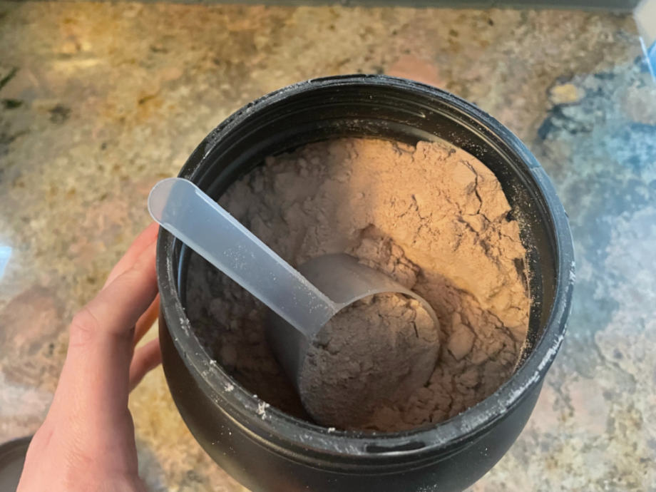 Looking down into an open container of Kaged Whey Protein Isolate